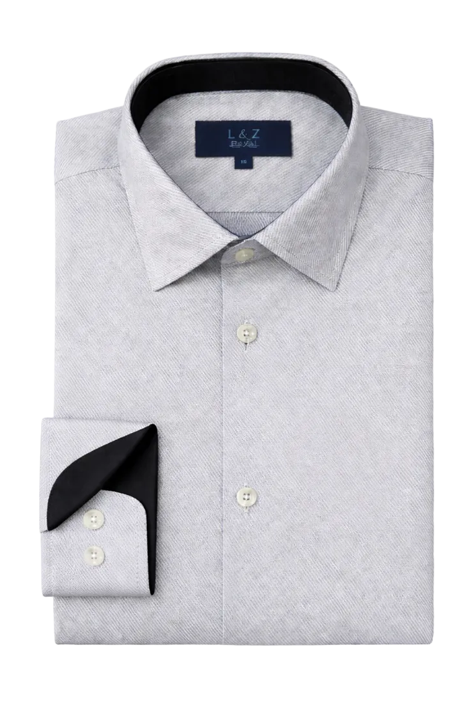 Folded gray dress shirt with black cuff and collar on a white background