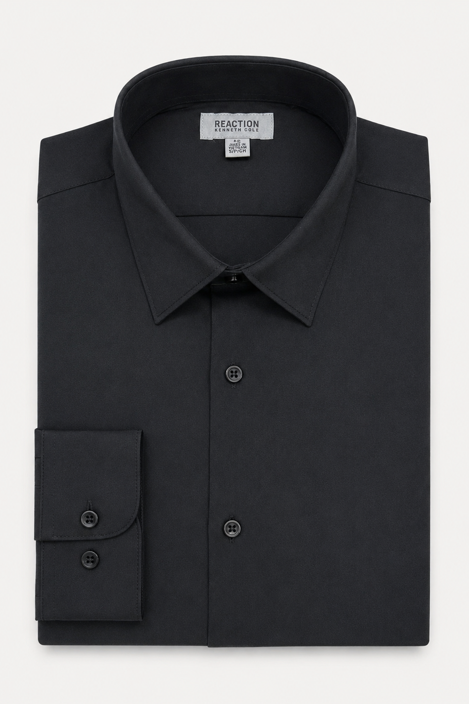 A folded black long-sleeve dress shirt with a pointed collar, button-down front, and a single-button cuff, shown on a light gray background. The inner neck label reads REACTION Apparel.