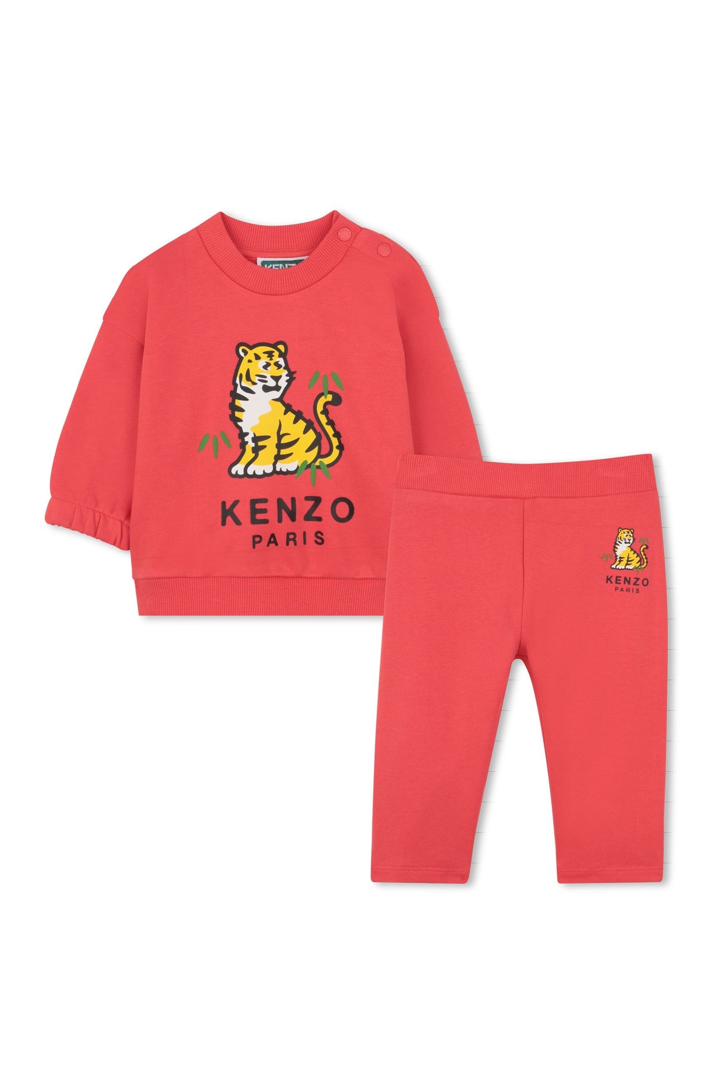 Red children's sweatshirt and pants set with a tiger logo and 'Kenzo Paris' text on a white background.