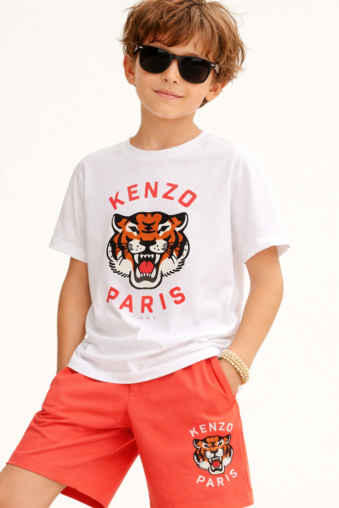 Child wearing a Kenzo Paris t-shirt and shorts on a white background