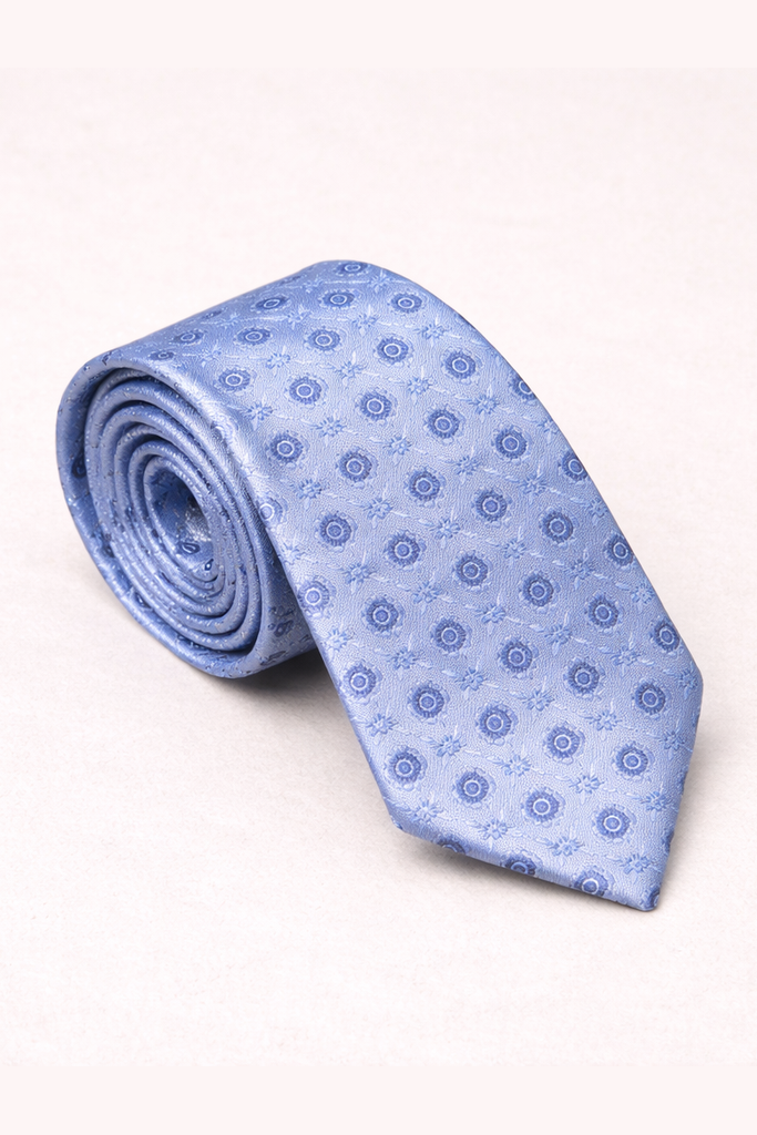 Rolled-up light blue tie with a subtle pattern on a white background