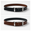 Two black leather belts with silver buckles on a white background