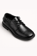Black leather dress shoe on a white background