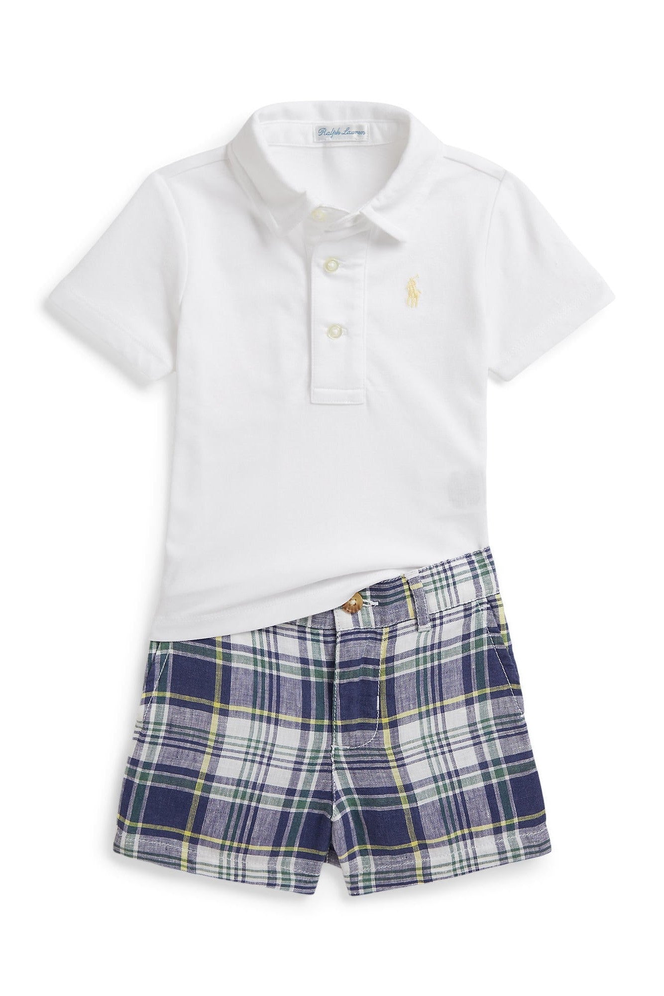 White polo shirt and blue plaid shorts set on a white background
