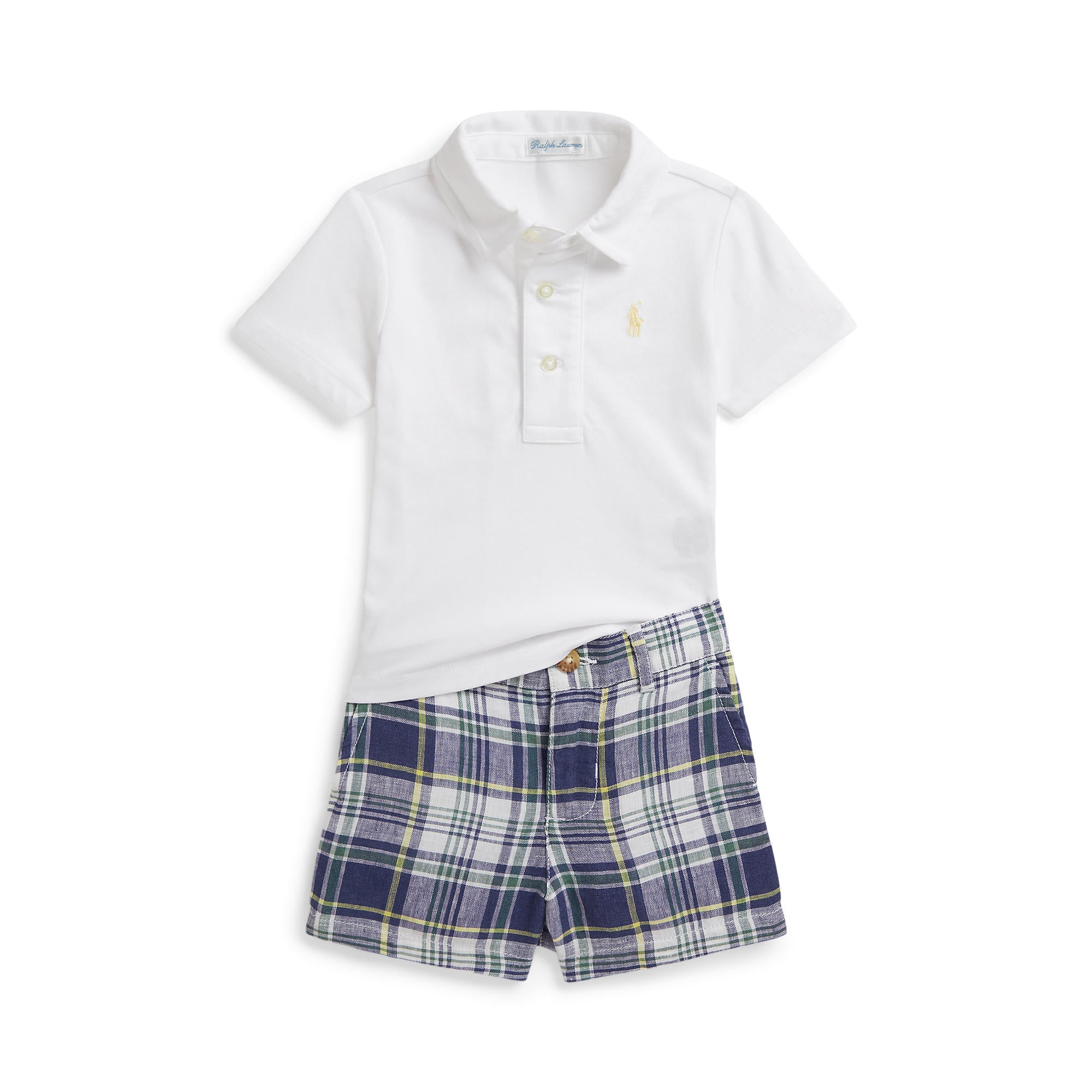 White polo shirt and blue plaid shorts set on a white background