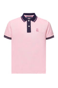 Pink polo shirt with navy accents on a white background